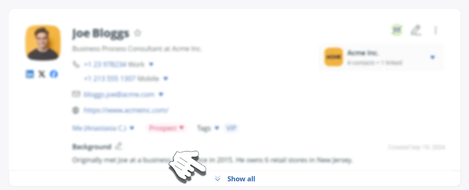 The top of a OnePageCRM contact page with its details blurred out and a hand cursor pointing at the Show all button that reveals them