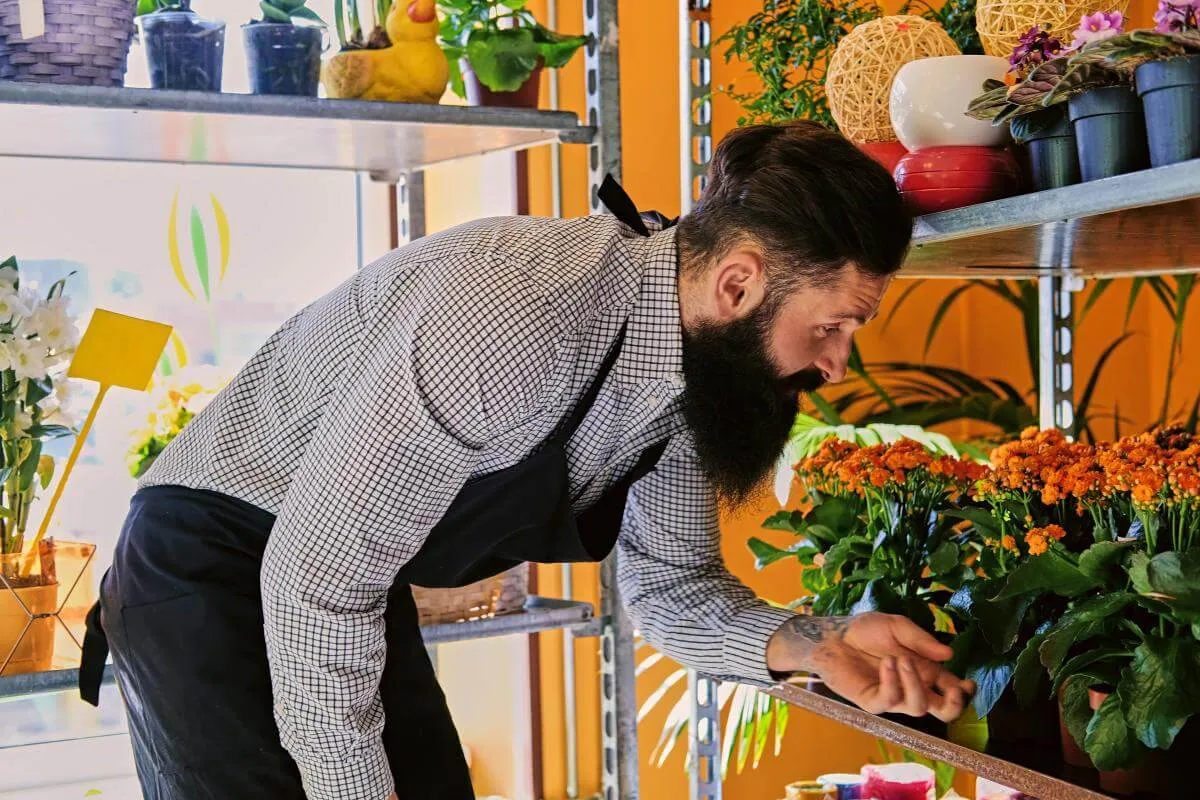 florist tending plants in a flower shop