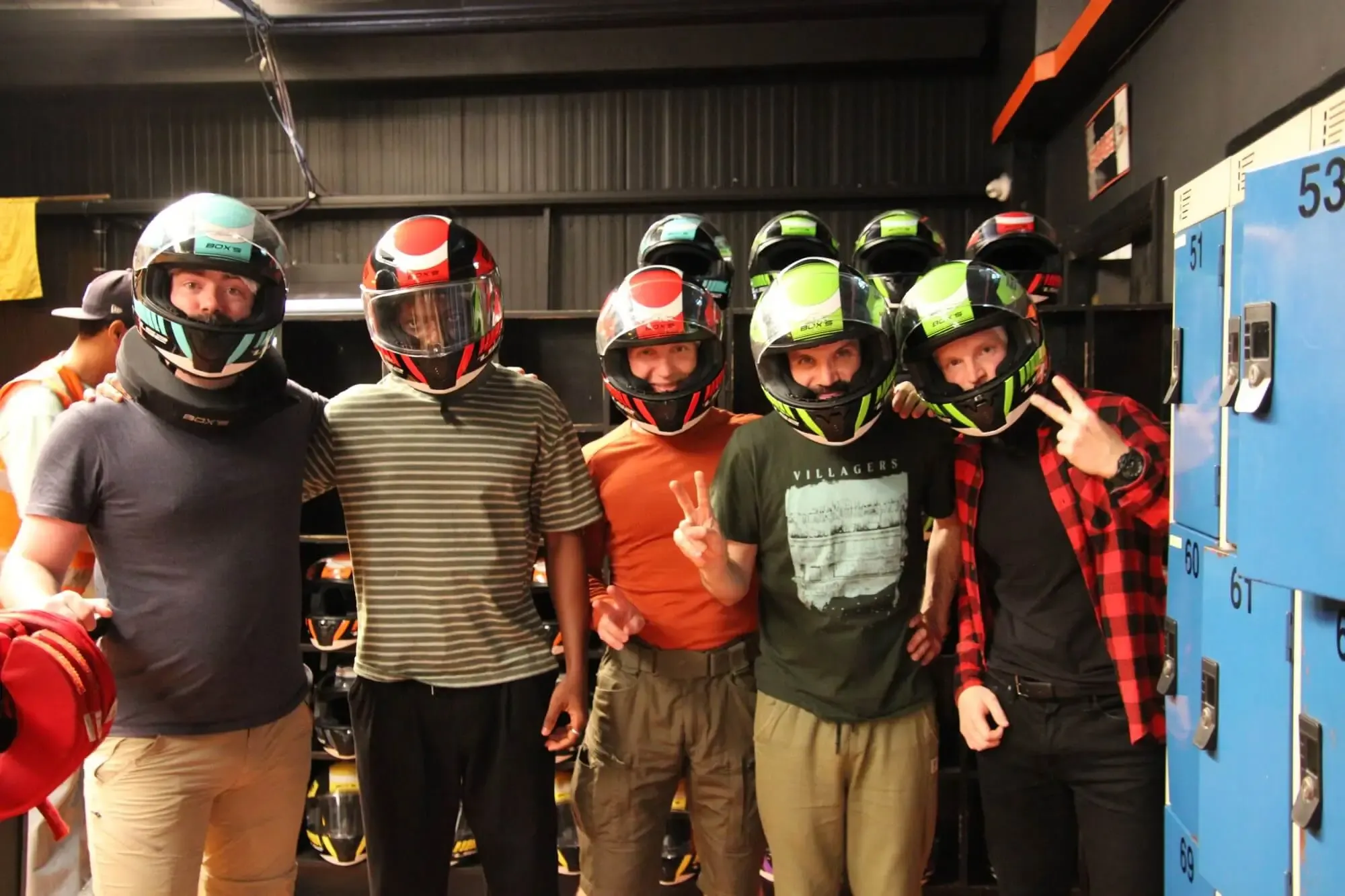 The team in helmets before a go-karting race