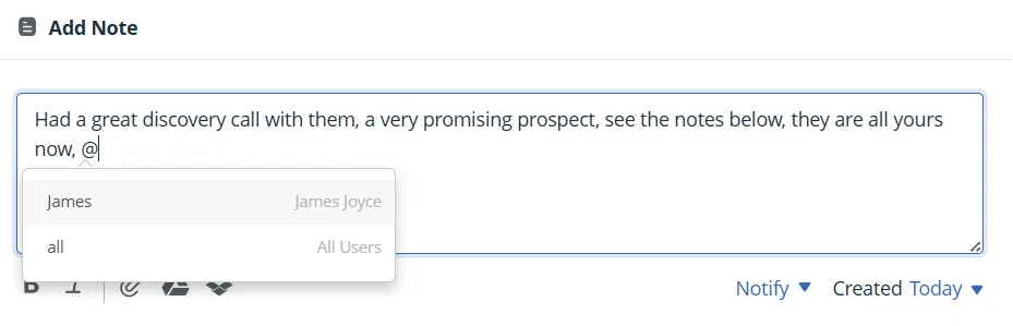 A note being written on a contact in OnePageCRM, with an @ mention part-typed and a menu offering a named teammate or all users