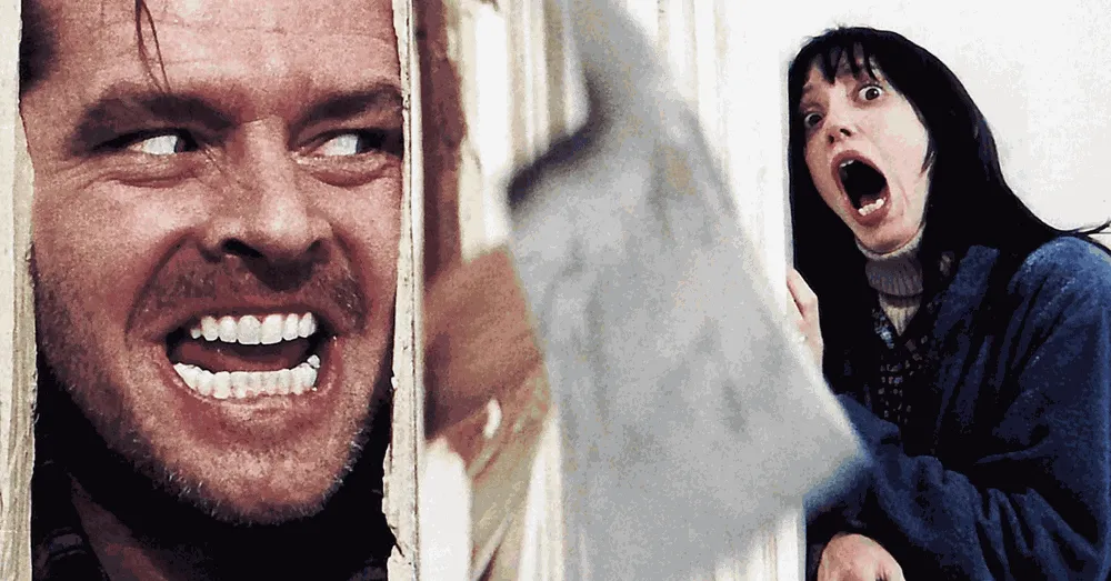 Jack Torrance breaking through a door with an axe in The Shining